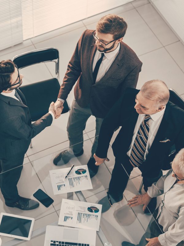 top view. business people greeting each other before the meeting. business concept.